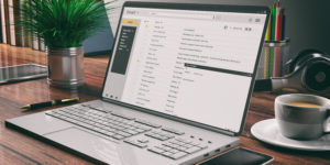 Mad Men Markeing - Pittsburgh Website Design And Digital Marketing Agency - Image Emails On A Laptop Screen Wooden Desk Office Backg 7Makhwv