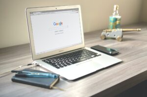 Macbook Air On Grey Wooden Table